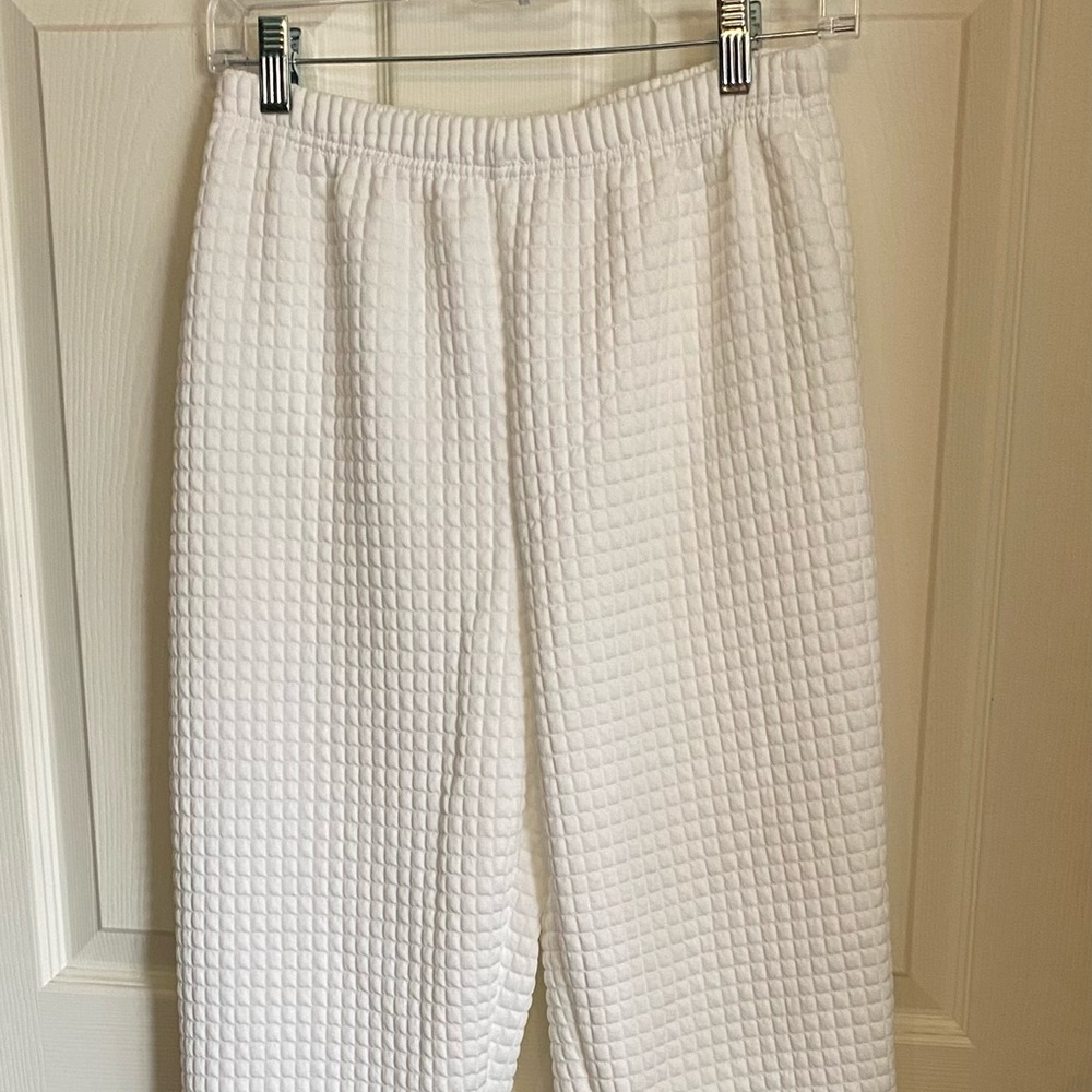 Cream colored, textured sweatpants with matching top